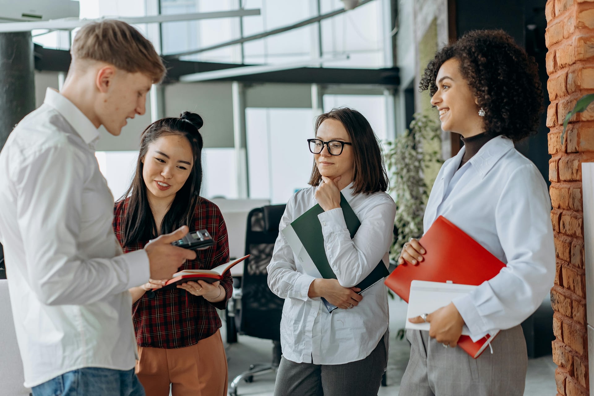 hiring for culture add -- photograph of coworkers talking