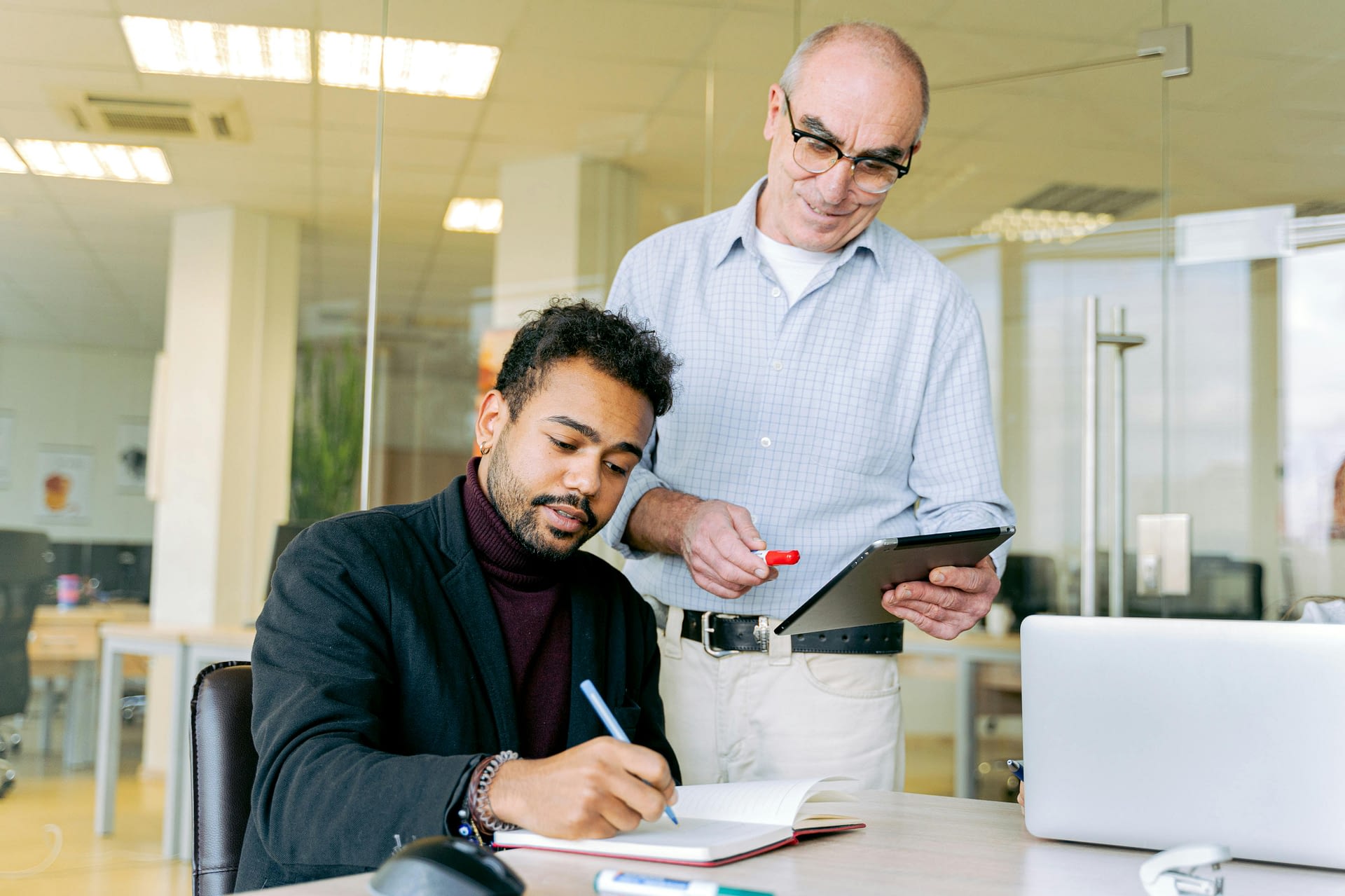 pros and cons of 360-feedback -- two men having a meeting in the office