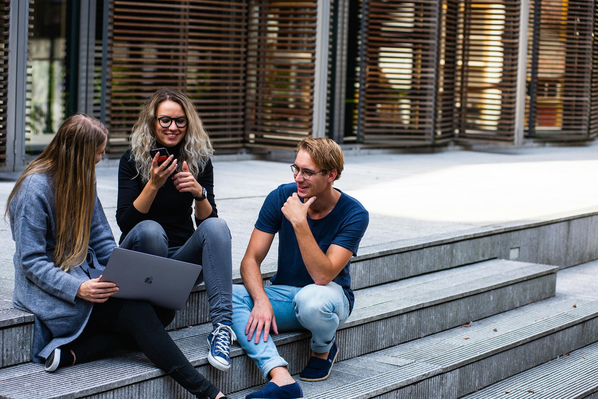 beyond productivity -- a group collaborating by a staircase